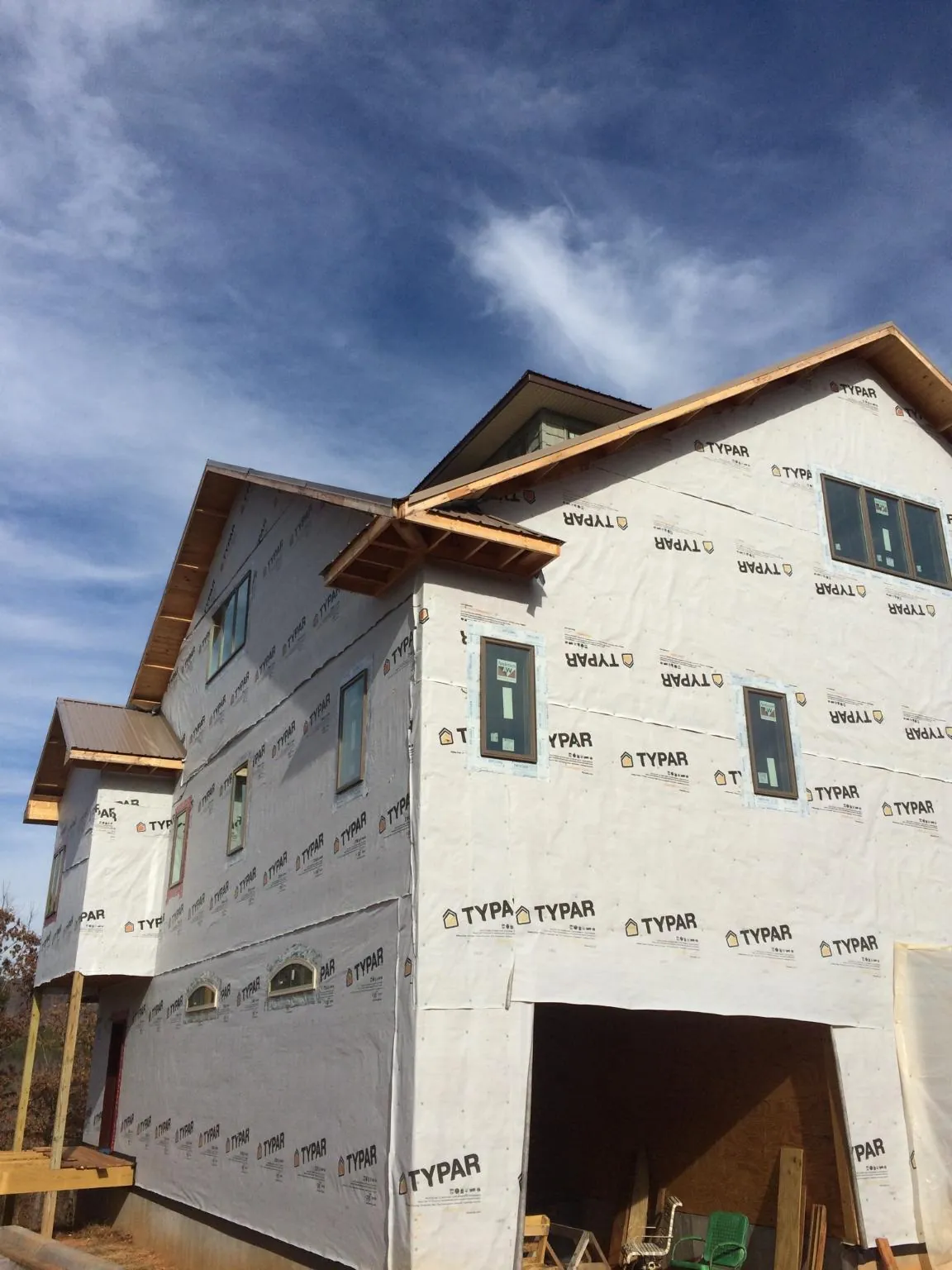 Stick built house wrapped in Typar with new roof framing and dormers in Cashiers